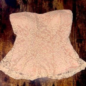 Adorable lace strapless sexy top size medium with tags. Never worn.